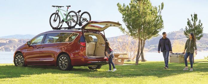 A 2021 Chrysler Pacifica carrying two bicycles on an available roof rack.