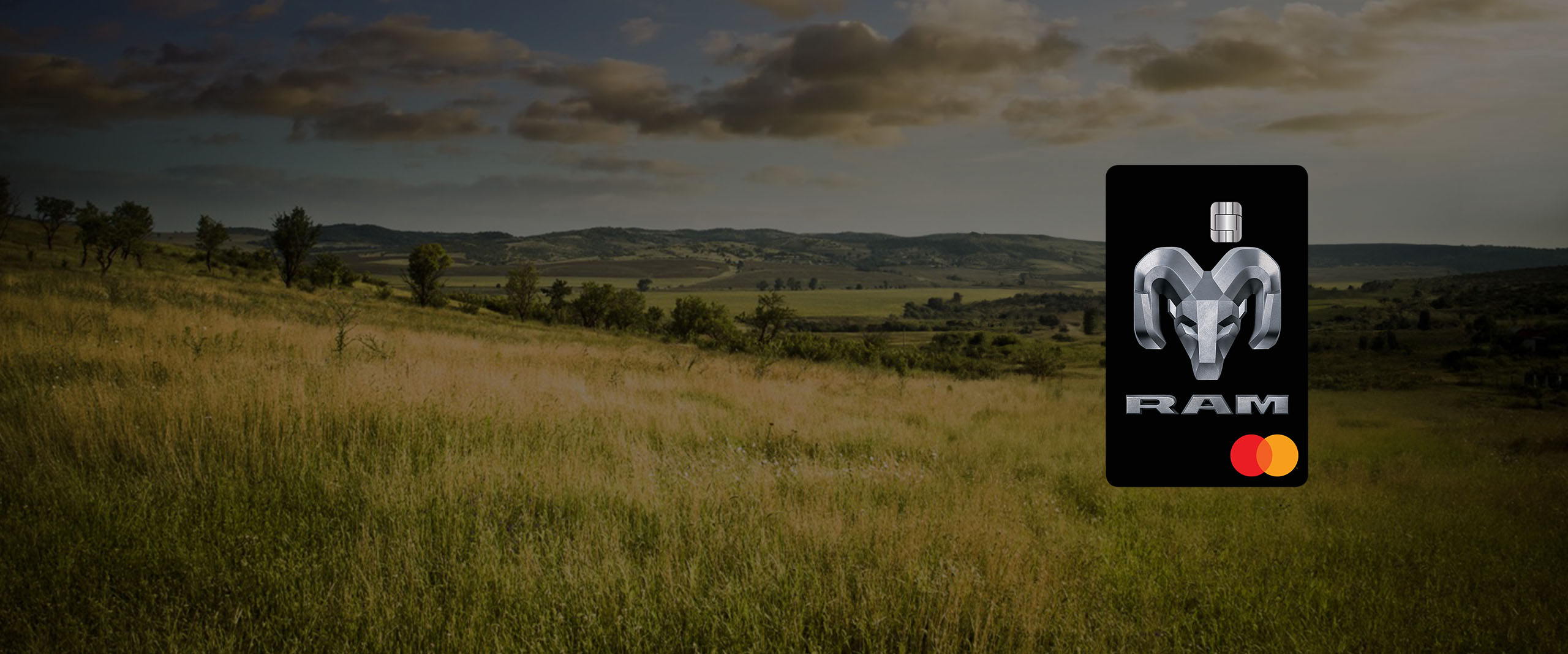 Mopar-branded Mastercard superimposed on a vista of a winding mountain road.