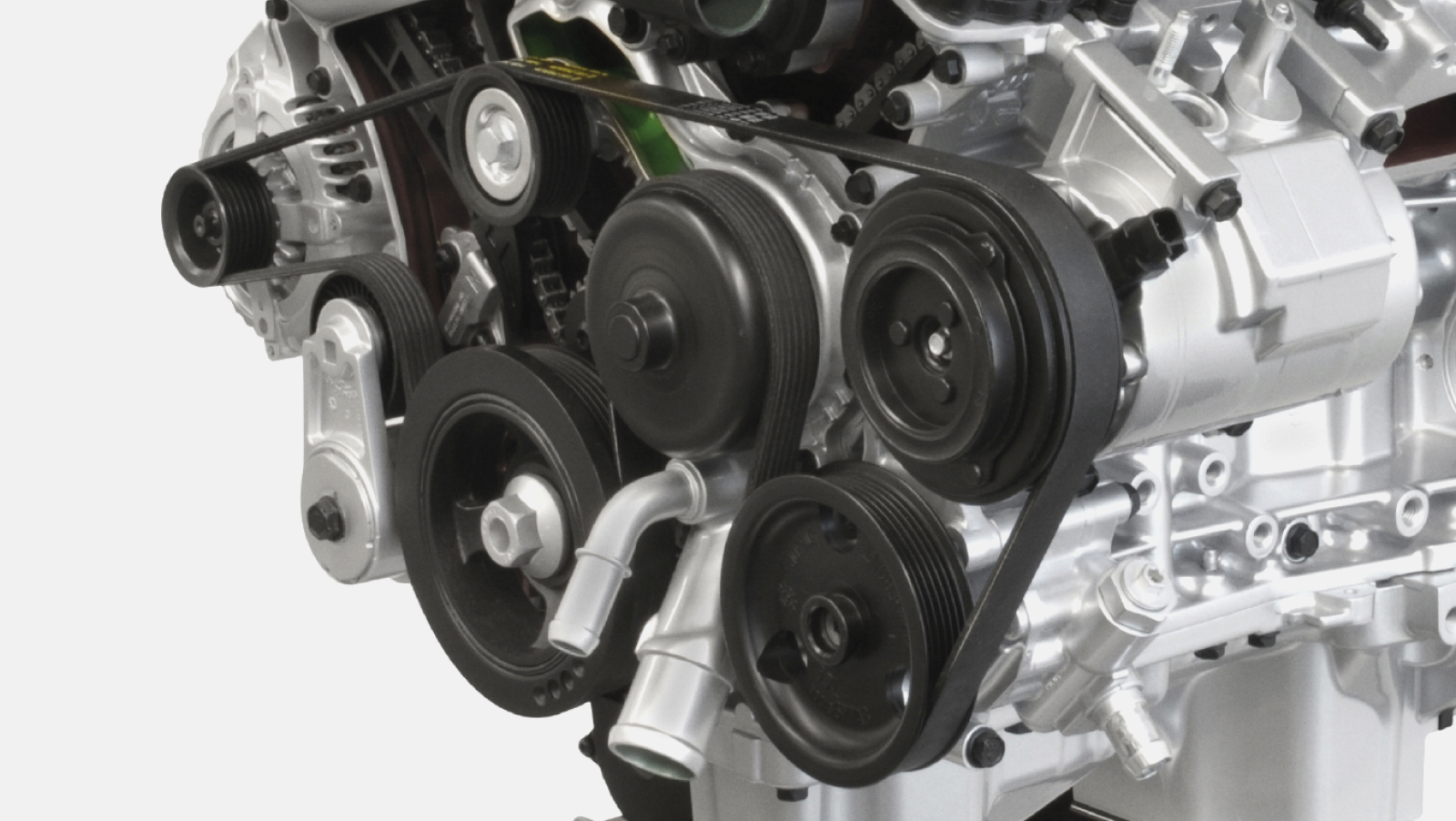 Serpentine belt running through all the pullies on an engine