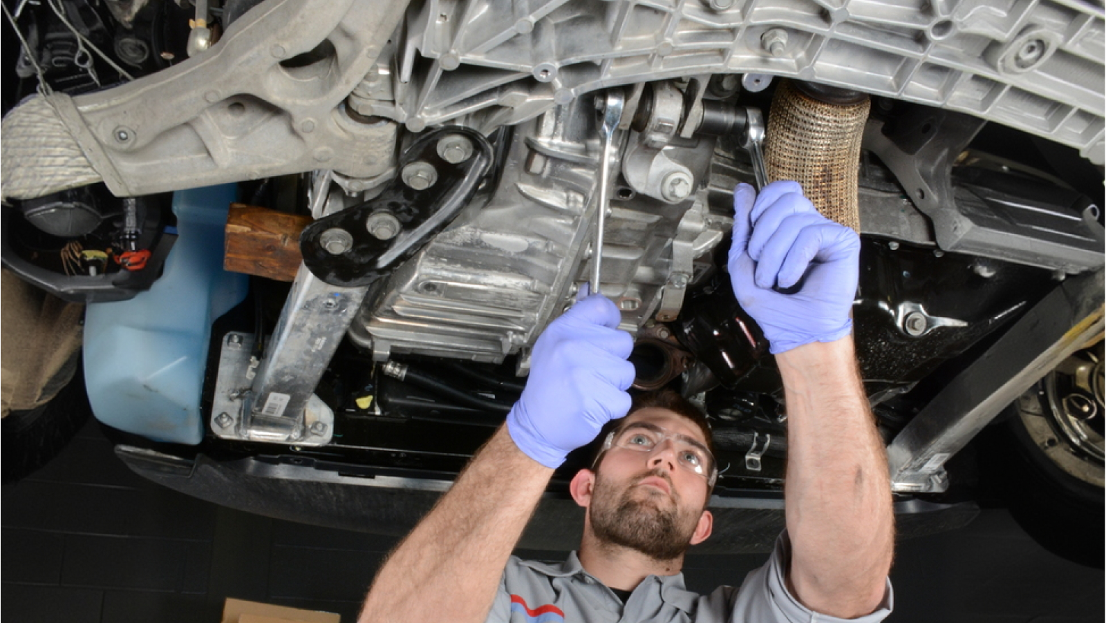 Mopar technician working on transmission